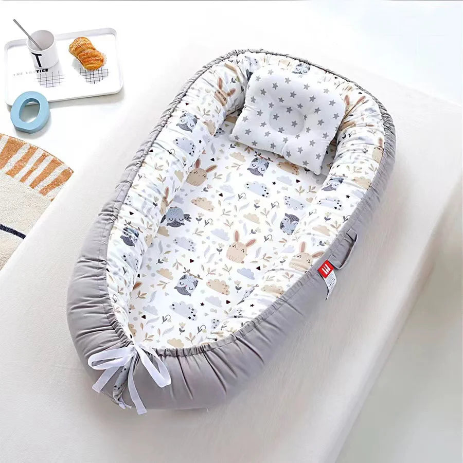 Forest animal-themed baby nest with cozy and breathable cotton fabric.