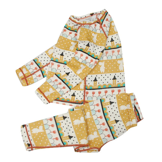 Barnens gyllene guldiga termo underställ i merinoull och bambu, mot en vit bakgrund produktbild