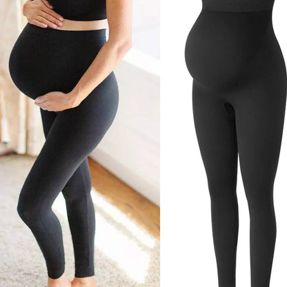 Svarta höga gravidleggings med magstöd på gravid modell