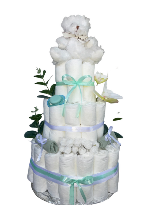 Elegant blöjtårta i turkos med orkidéblommor och eucalyptusblad för babyshower