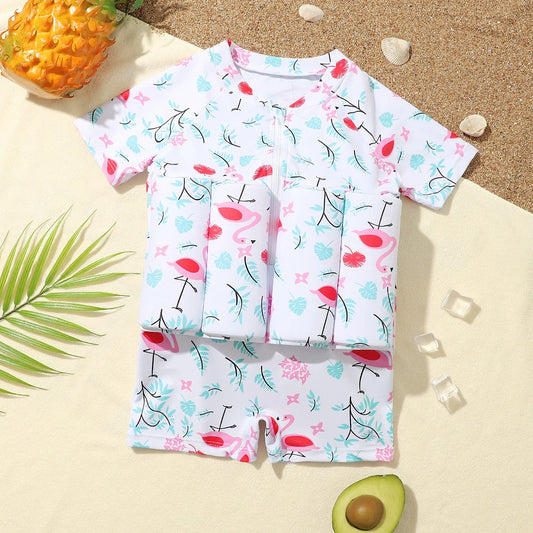Vit baddräkt med rosa flamingos och flytkuddar för barn