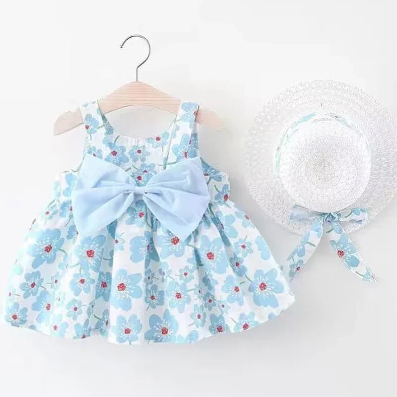 Blå blommig sommarklänning med rosett och hatt för flickor